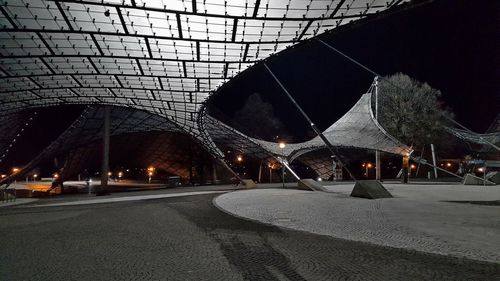 View of illuminated street lights at night
