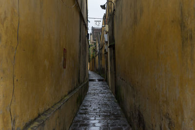 Narrow alley along buildings