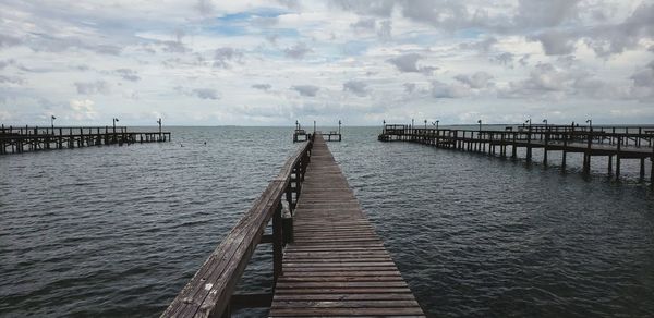 Pier over sea against sky