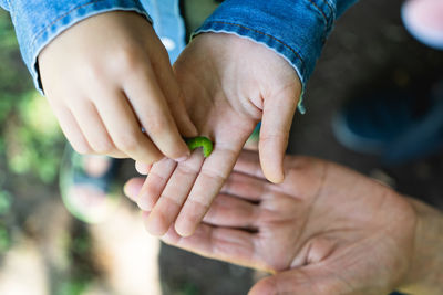 Close-up of man holding hands