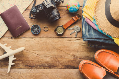 High angle view of travel and fashion accessory on table