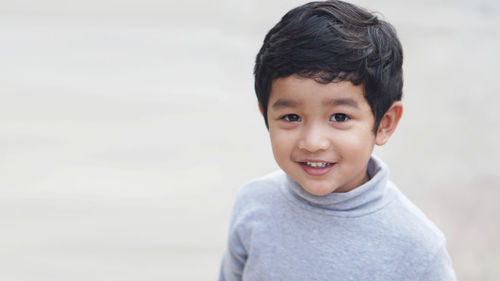 Portrait of cute boy smiling