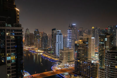 Illuminated buildings in city at night