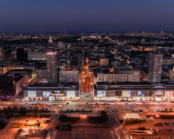 High angle view of illuminated cityscape against sky at night