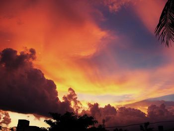 Low angle view of cloudy sky at sunset