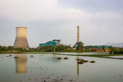 View of factory against sky