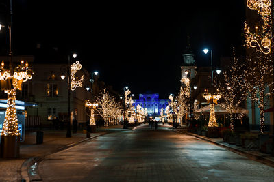 Magical christmas market in warsaw with people around buying presents.