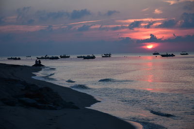 Scenic view of sea against sky at sunset