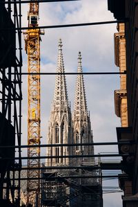 A cathedral in vienna seen through other urban structures, austria