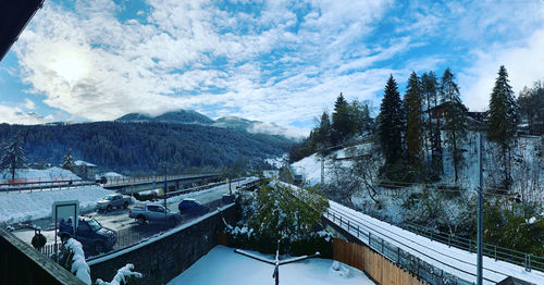 High angle view of trees and buildings against sky