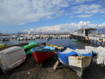 Boats moored at harbor