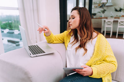 Young woman using mobile phone