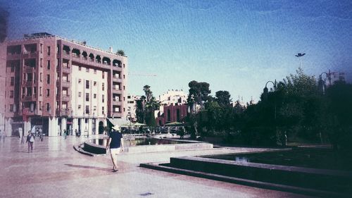Buildings in city against sky