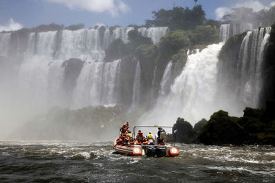 Scenic view of waterfall in sea