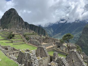 Panoramic view of mountains against cloudy sky