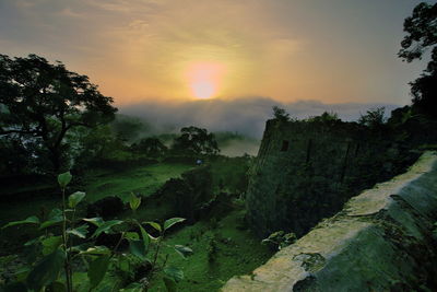 Scenic view of landscape against sky during sunset