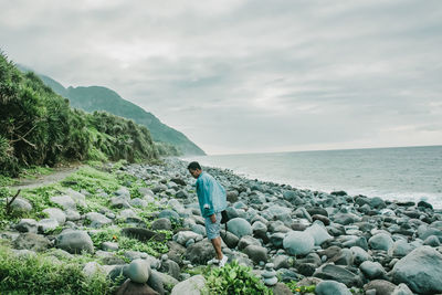 Scenic view of sea and rocks against sky