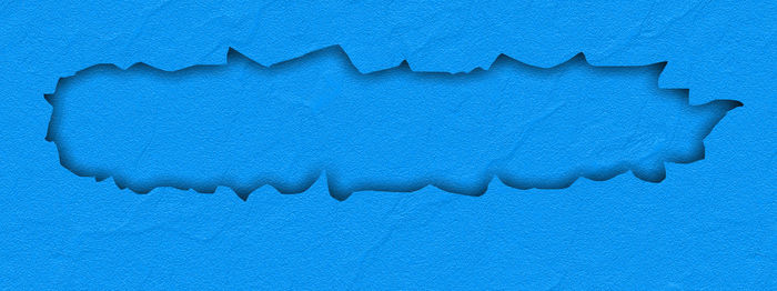 Close-up of blue paint on white background
