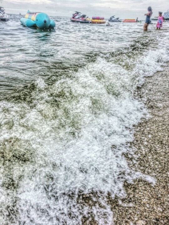 water, sea, beach, men, shore, tranquility, tranquil scene, calm, nature, scenics, day, waterfront, beauty in nature, outdoors, vacations, person, ocean, remote, coastline, coastal feature