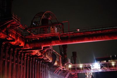 Low angle view of illuminated ferris wheel