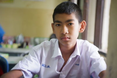 Portrait of student sitting in laboratory