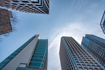 Low angle view of modern buildings against sky