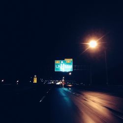 Illuminated road at night