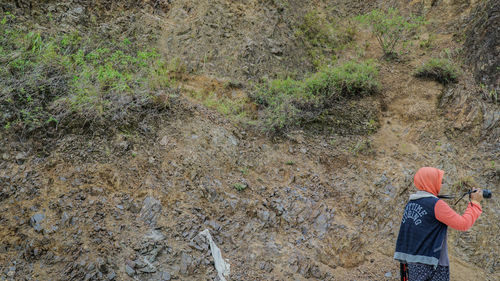 Low section of man standing on ground