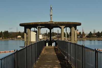 Bridge over river against clear sky