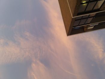 Low angle view of building against sky during sunset