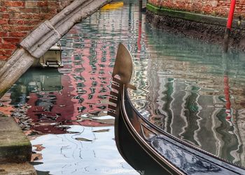 High angle view of canal amidst buildings