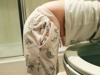 Close-up of man in bathroom at home