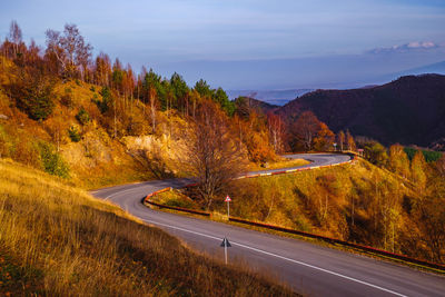 Road amidst trees against sky during autumn,  paltinis area, sibiu county, romania