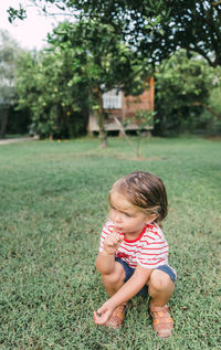 Full length of cute baby girl on land