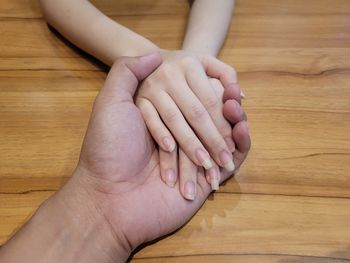 High angle view of baby feet on table