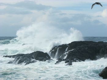 Waves breaking against sea