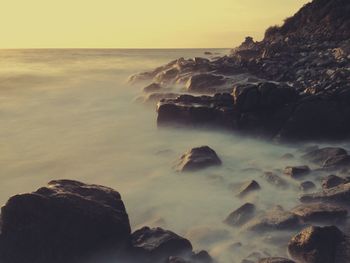 Scenic view of sea against sky during sunset