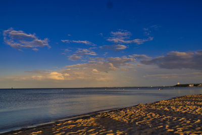 Scenic view of sea against blue sky