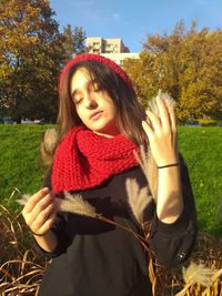 Woman with eyes closed standing in park during autumn