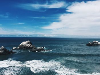 Scenic view of sea against cloudy sky