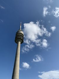 Low angle view of communications tower against sky