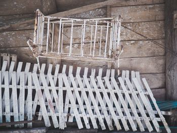 High angle view of empty chairs against wall