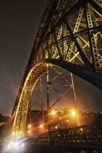 Low angle view of illuminated ferris wheel at night