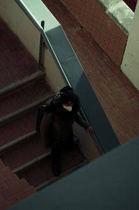 High angle view of woman on staircase