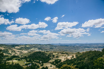 High angle shot of townscape against clouds