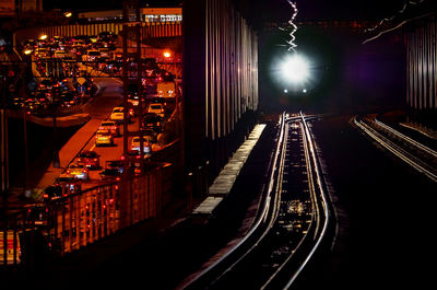 High angle view of railroad tracks at night
