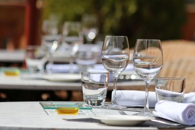 Glass of wine glasses on table in restaurant