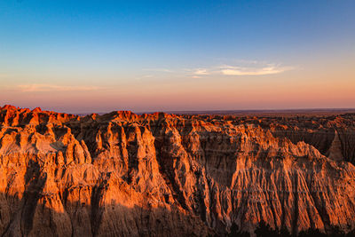 Scenic view of mountains against sky during sunset