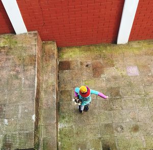 High angle view of boy on footpath