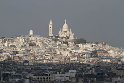 High angle view of buildings in city against clear sky